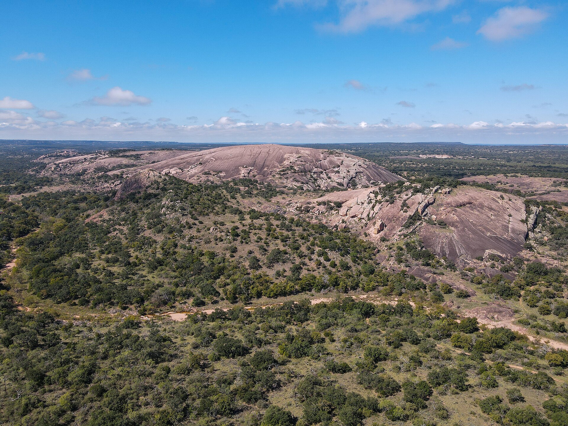 Aerial view of Enchanted Rock pink granite dome